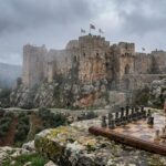 Chessboard overlooking misty hilltop stone castle